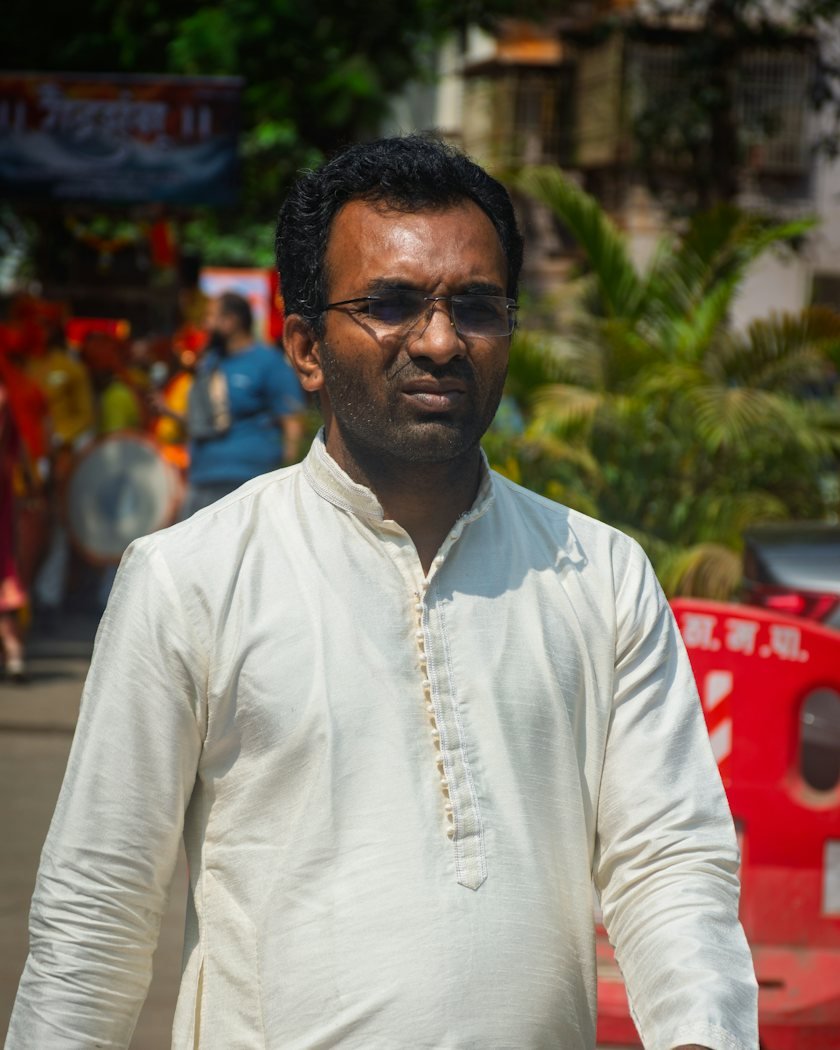 A man in a kurta taking a walk outdoors