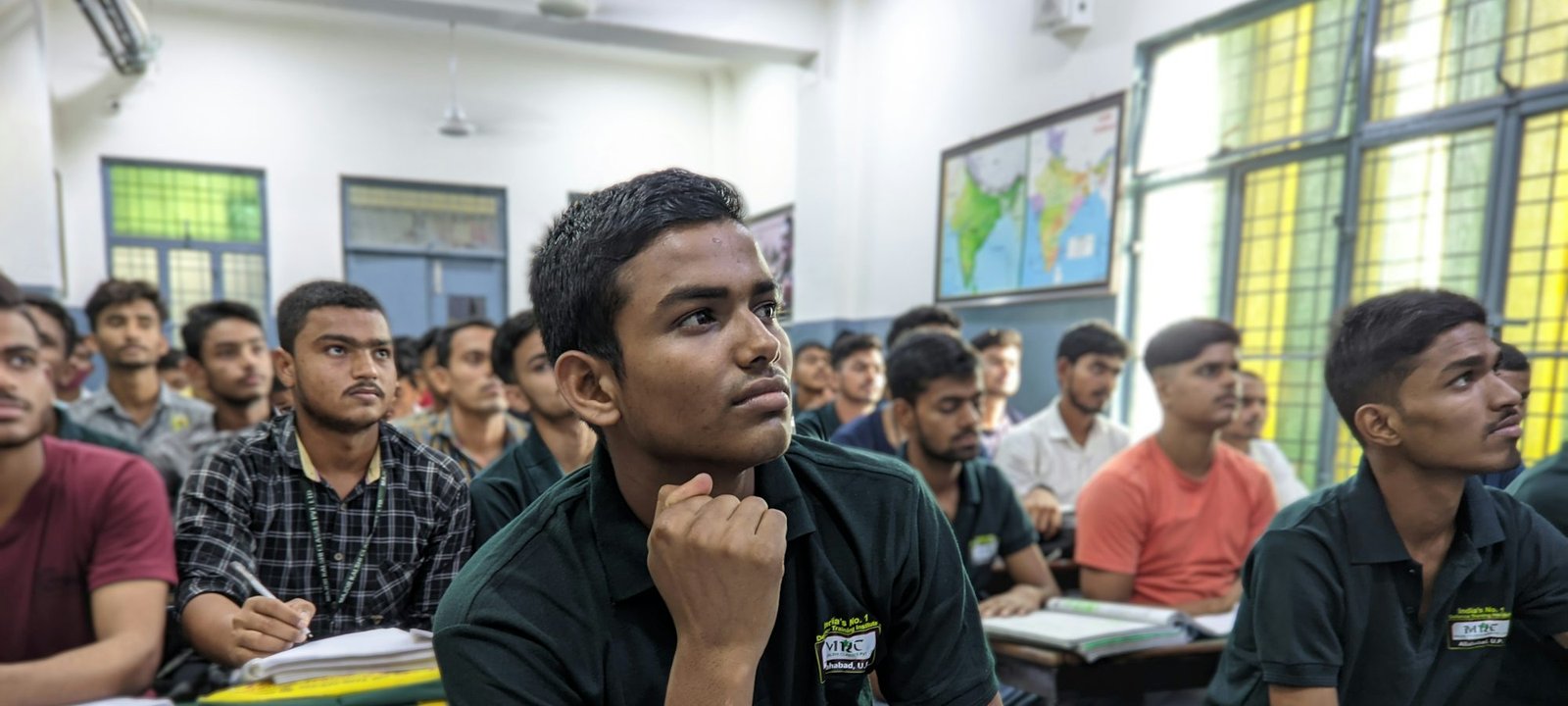College students listening attentively in a classroom